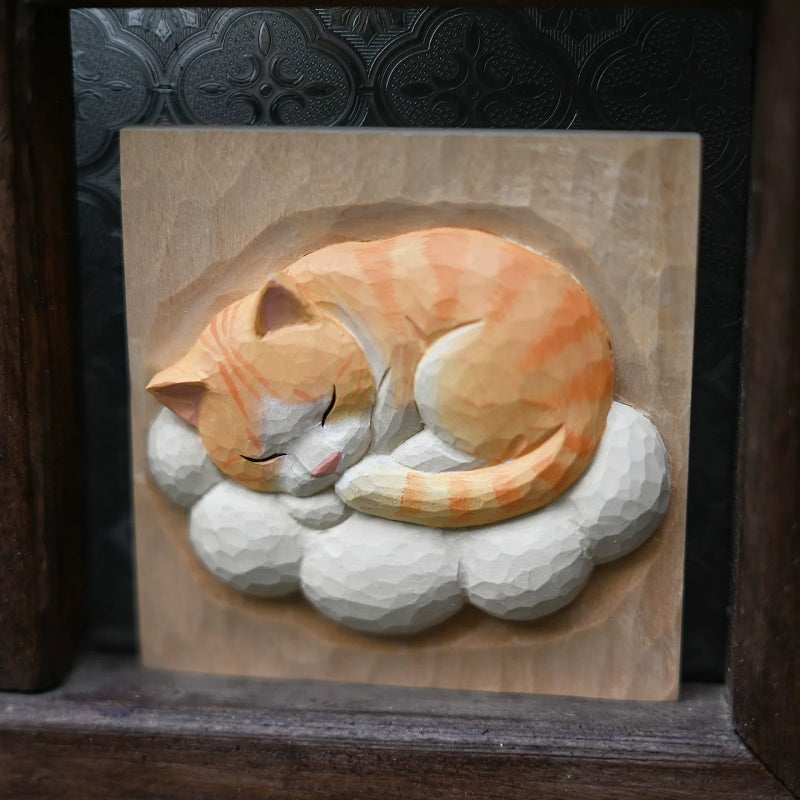 Sleeping cat wood relief close up