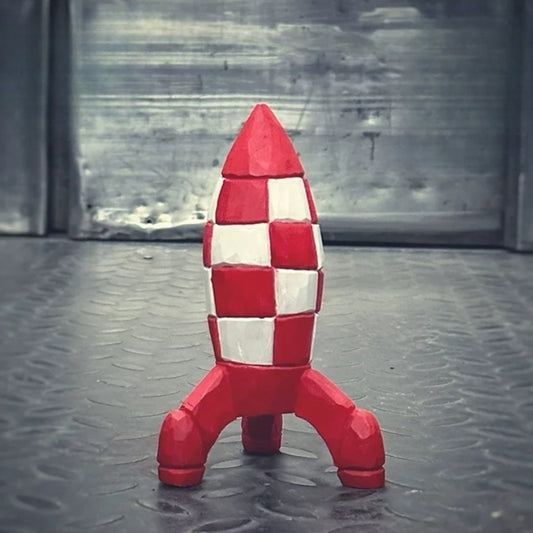 Space rocket figurine on industrial gray floor