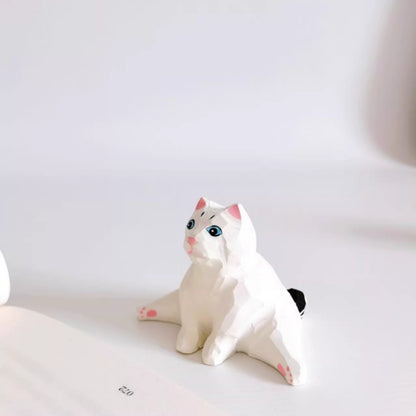 Split pose cat figurine sitting with legs stretched