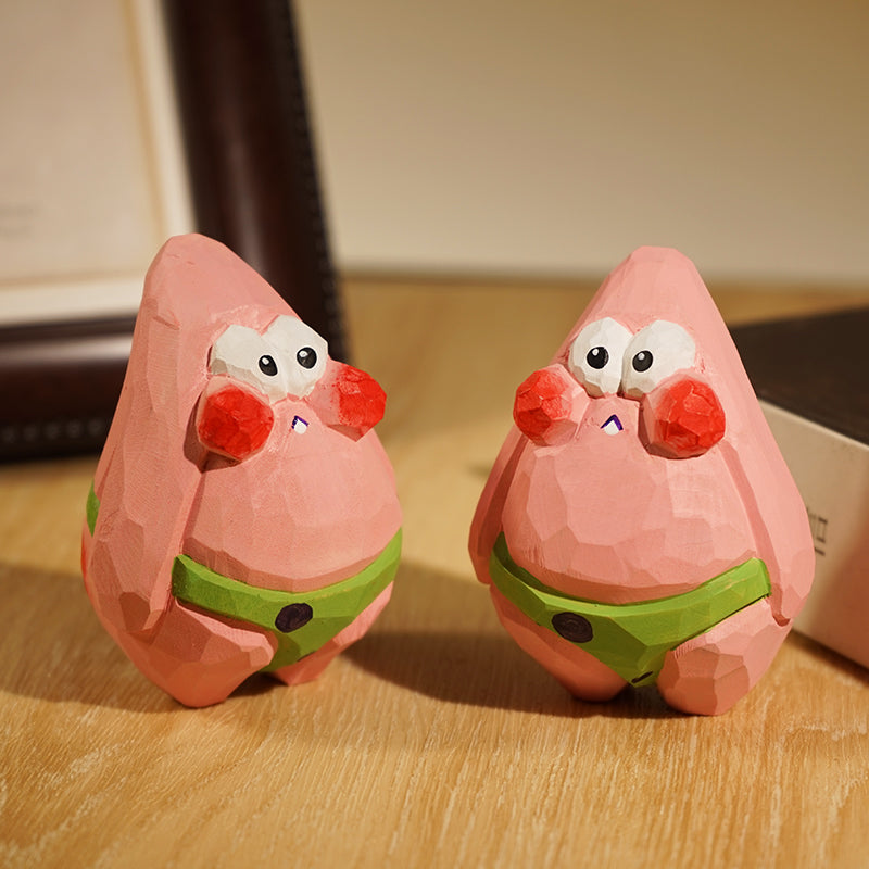 Artisanal wooden figures of Patrick from the Spongebob Squarepants series.