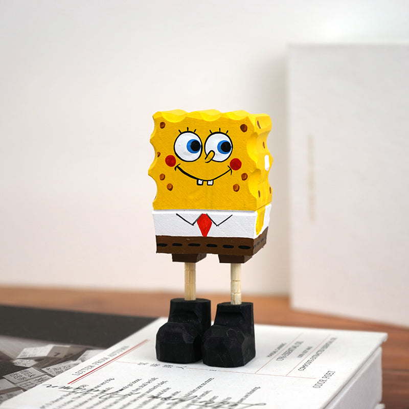 Collectible wooden statues of Spongebob Squarepants on a light background.