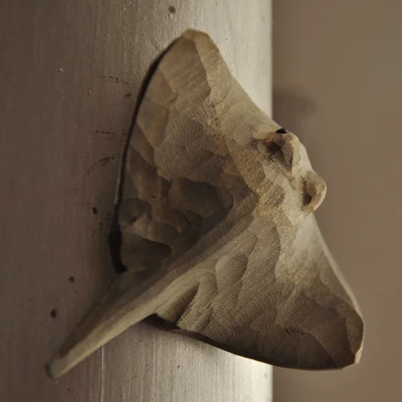 Angled view of hand-carved stingray magnet