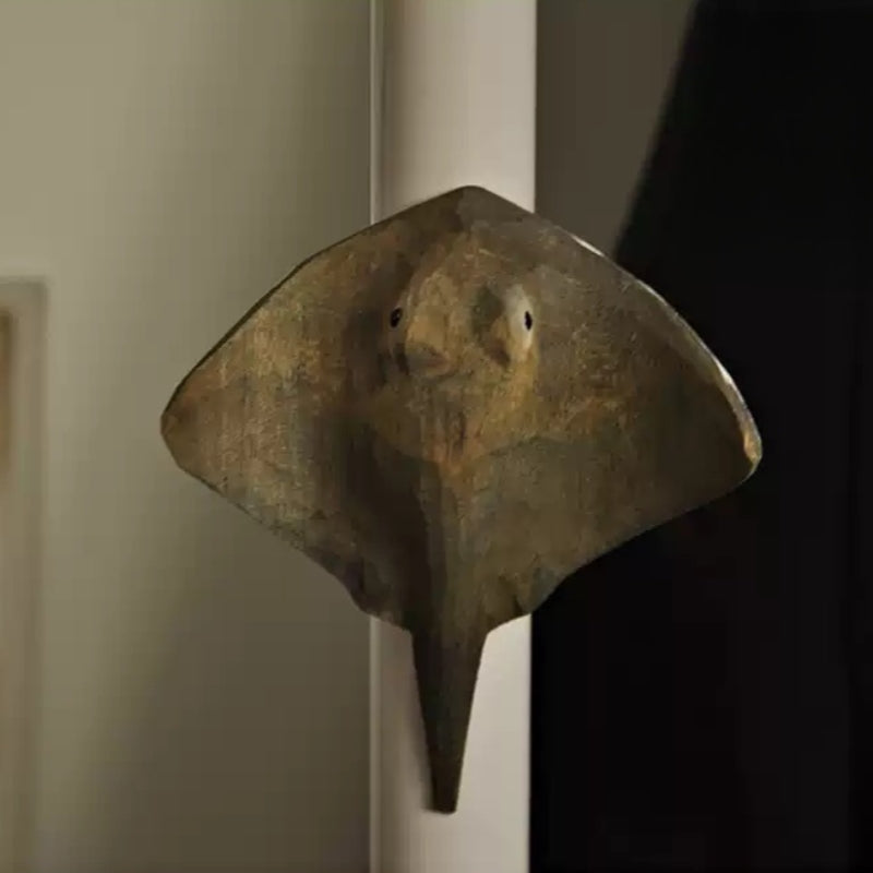 Stingray magnet mounted on a white door frame