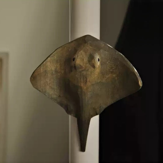 Stingray magnet mounted on a white door frame
