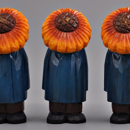 Three identical sunflower man figures lined up in a row, front-facing.