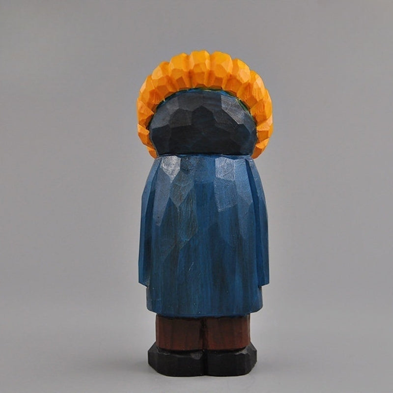 Back view of the wooden sunflower man figure, showing the carved coat and sunflower petals.