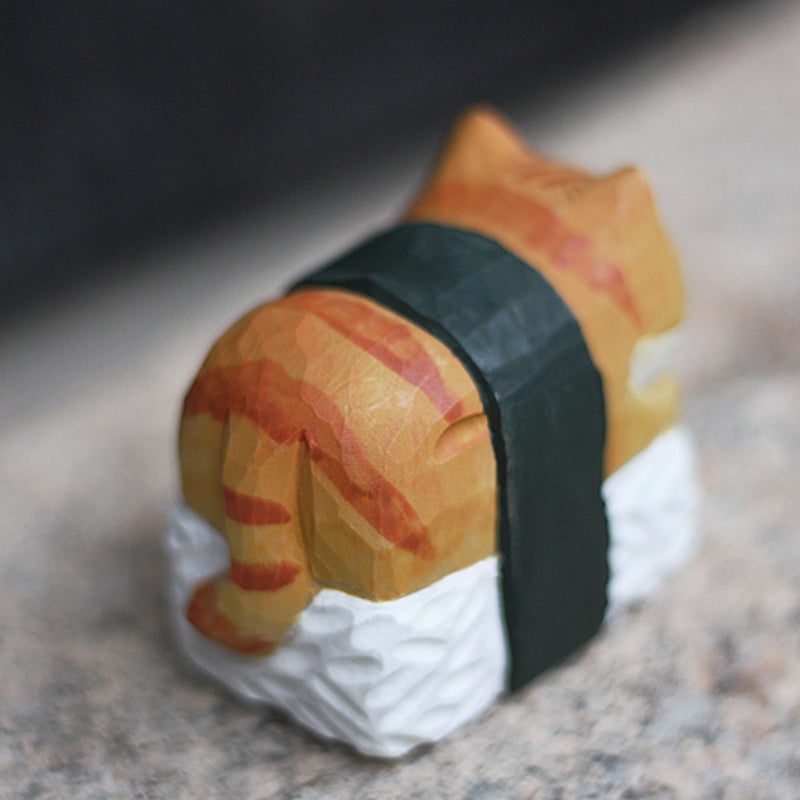 Sushi sleeping cat wood sculpture showing grain detail in wood