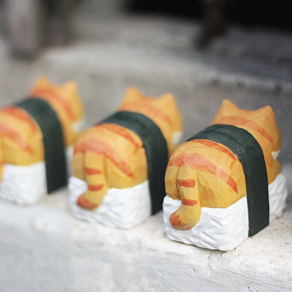 Sushi sleeping cat wooden statues showing back detail.