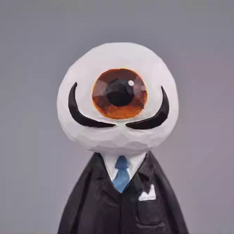 Close-up of the wooden Eyeball Figure’s face, featuring a large, painted eyeball and black curved lines resembling eyebrows.