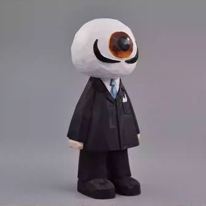 Angled view of the wooden Eyeball Figure highlighting the sculpted details of the suit and large eye.