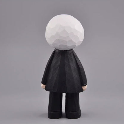 Back view of the eyeball figure showing its faceted white head and black suit