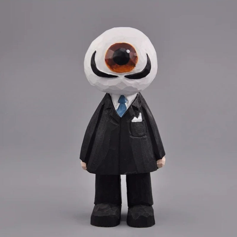 Wooden eyeball figure with a brown eye, curled black mustache, black suit, and blue tie, front view