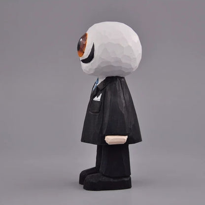 Side view of the eyeball figure with a rounded white head, black suit, and broad black shoes