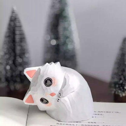 Tilted head cat wooden figurine