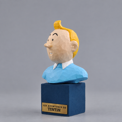 Tintin bust on a blue wooden display stand with a Les Aventures de Tintin plaque