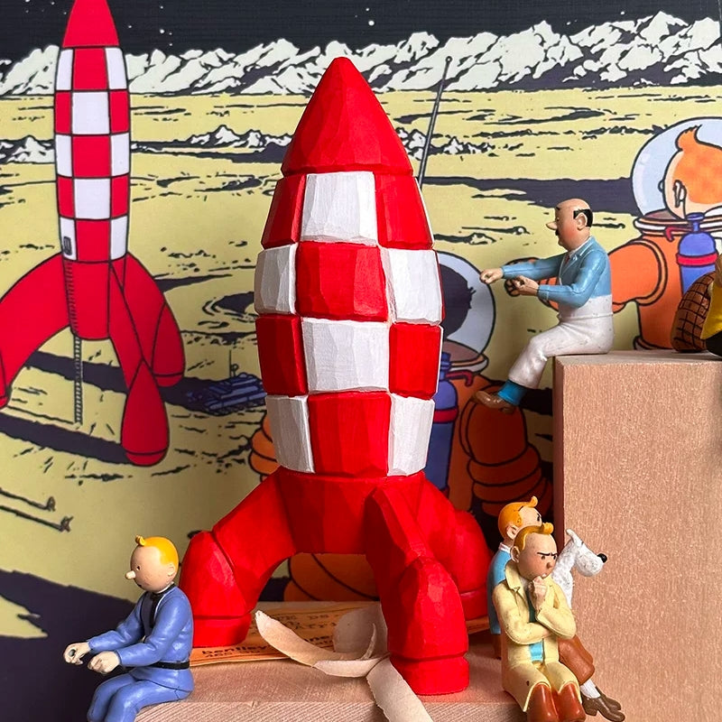 Wooden Tintin rocket displayed with Tintin character figurines against a Moon adventure comic backdrop