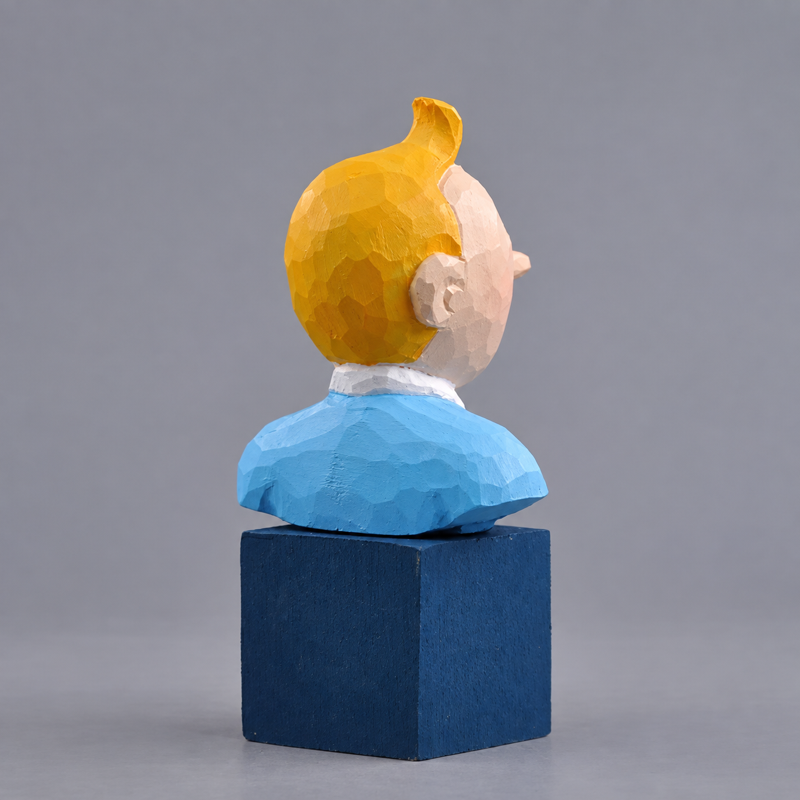 Rear view of the wooden Tintin bust showing yellow hair and a blue sweater