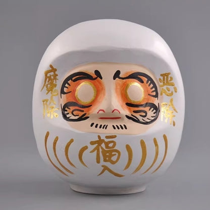 White Japanese daruma doll wooden figurine