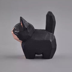 Tuxedo cat figurine side view with raised tail