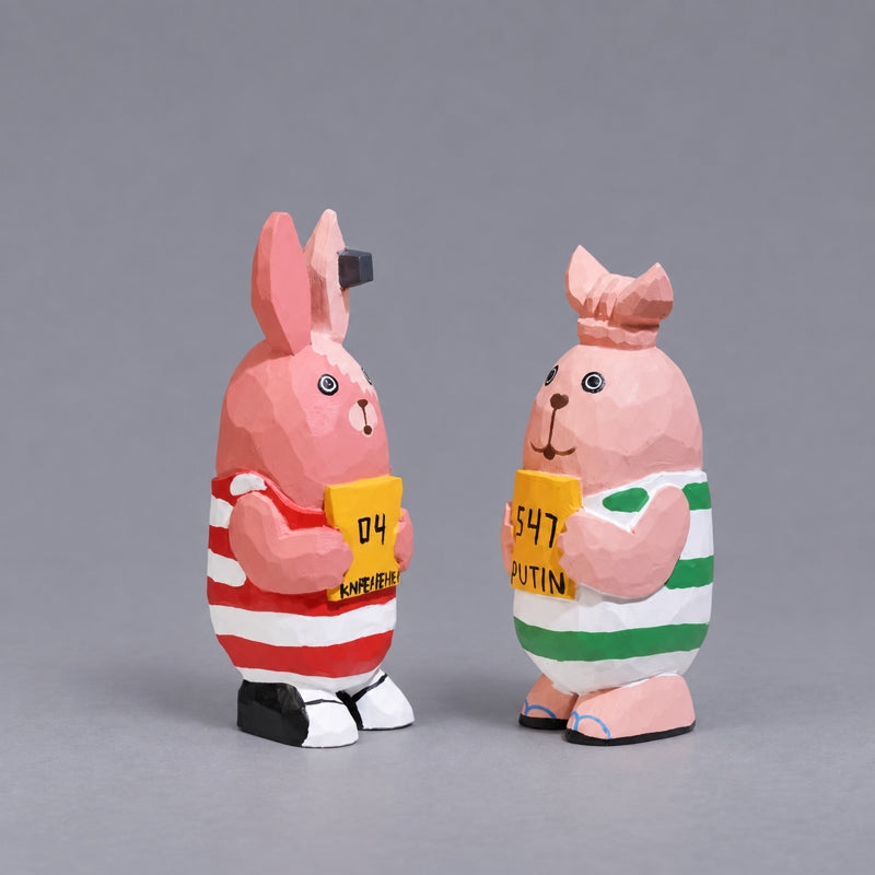 Kirenenko and Putin wooden figures with hand-lettered signs, angled view