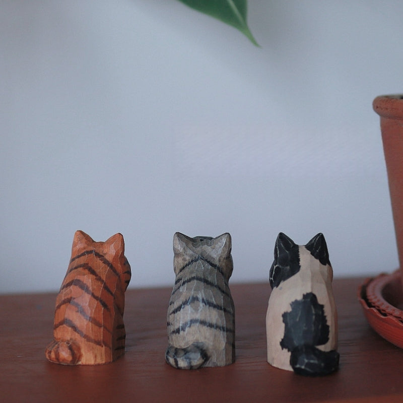 Back view of vintage cat wooden figurine set
