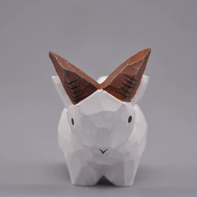 White goat figurine viewed from the front