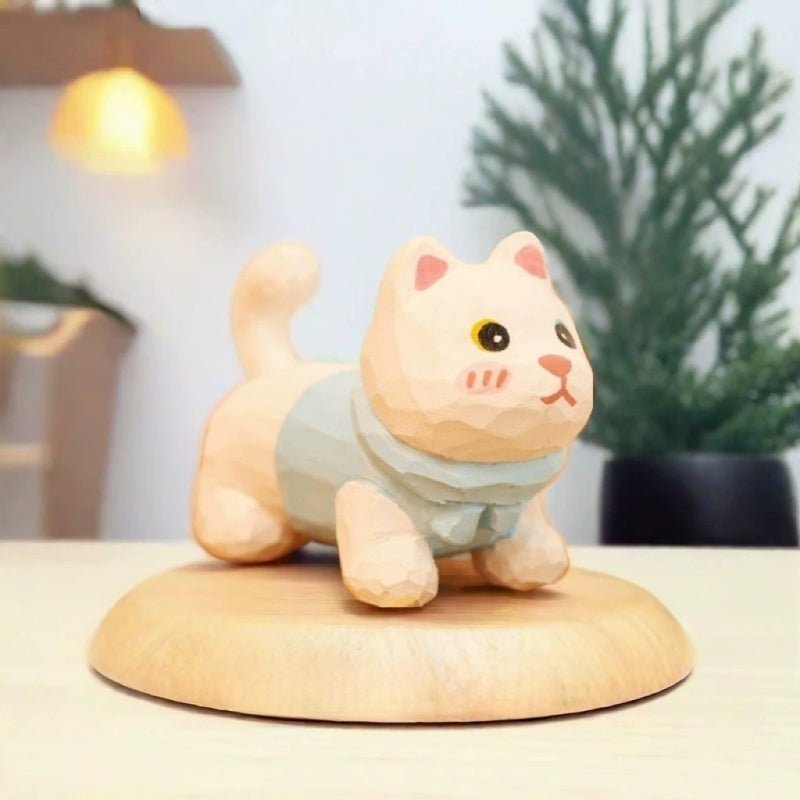 White kitten figurine in blue sweater