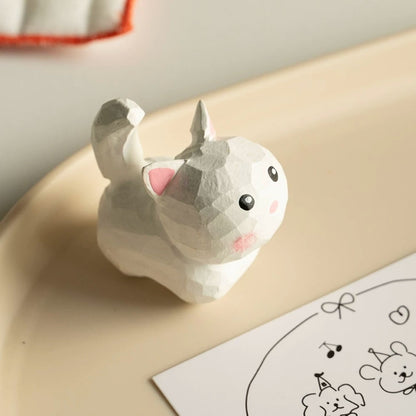 White mini cat figurine on plate