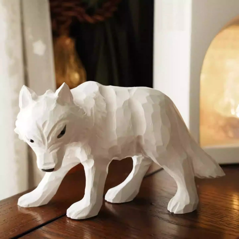 wooden white wolf figurine displayed on wooden surface