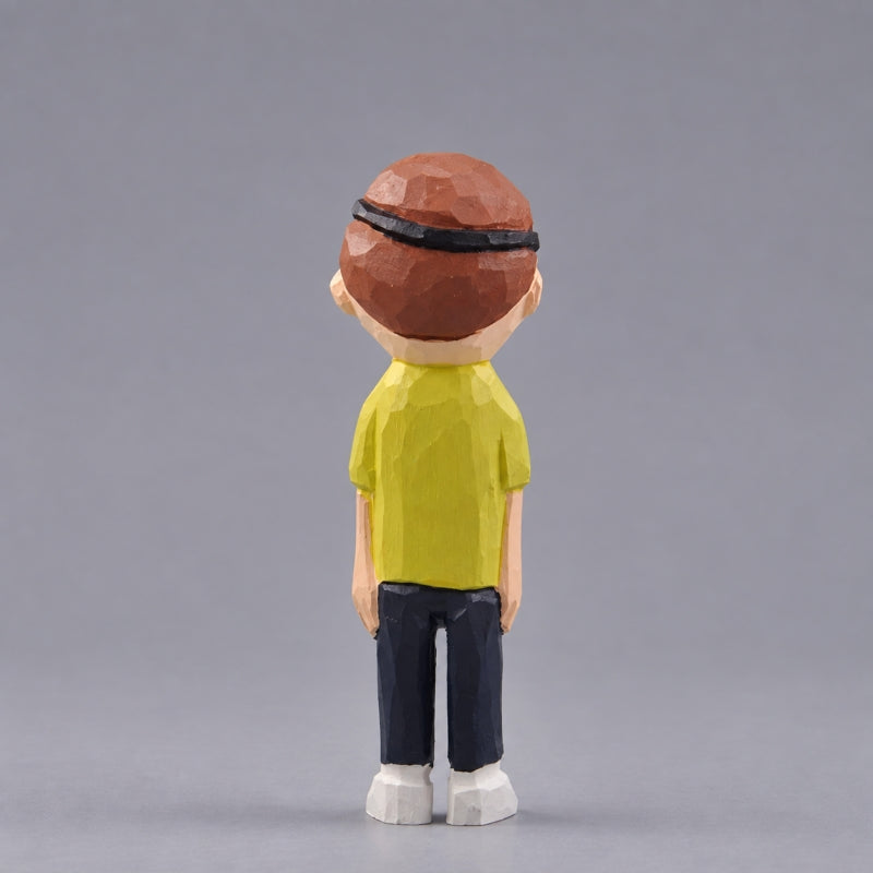 Rear view of wooden Evil Morty showing brown hair, a black eyepatch strap, and a yellow shirt