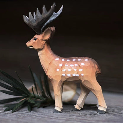 Male wooden deer figurine in side view, with broad dark antlers and white spots