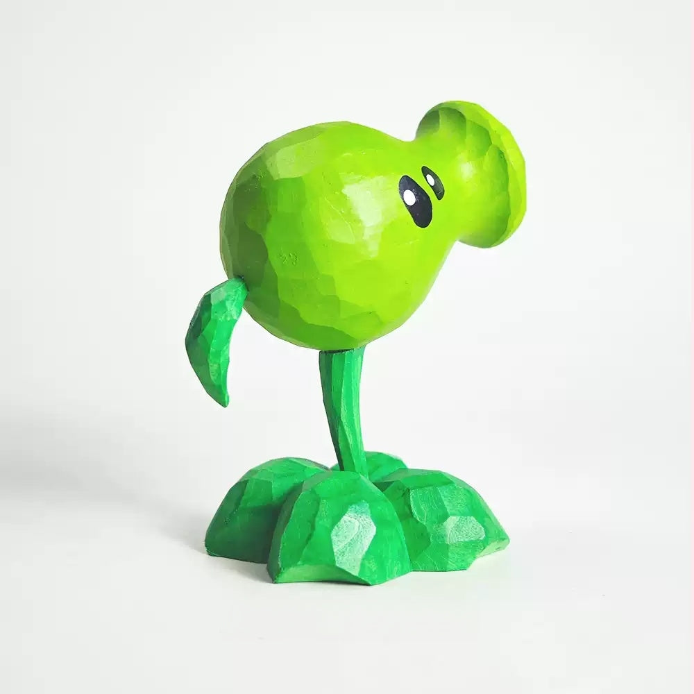 Side view of the wooden Peashooter with its small back leaf and light green head