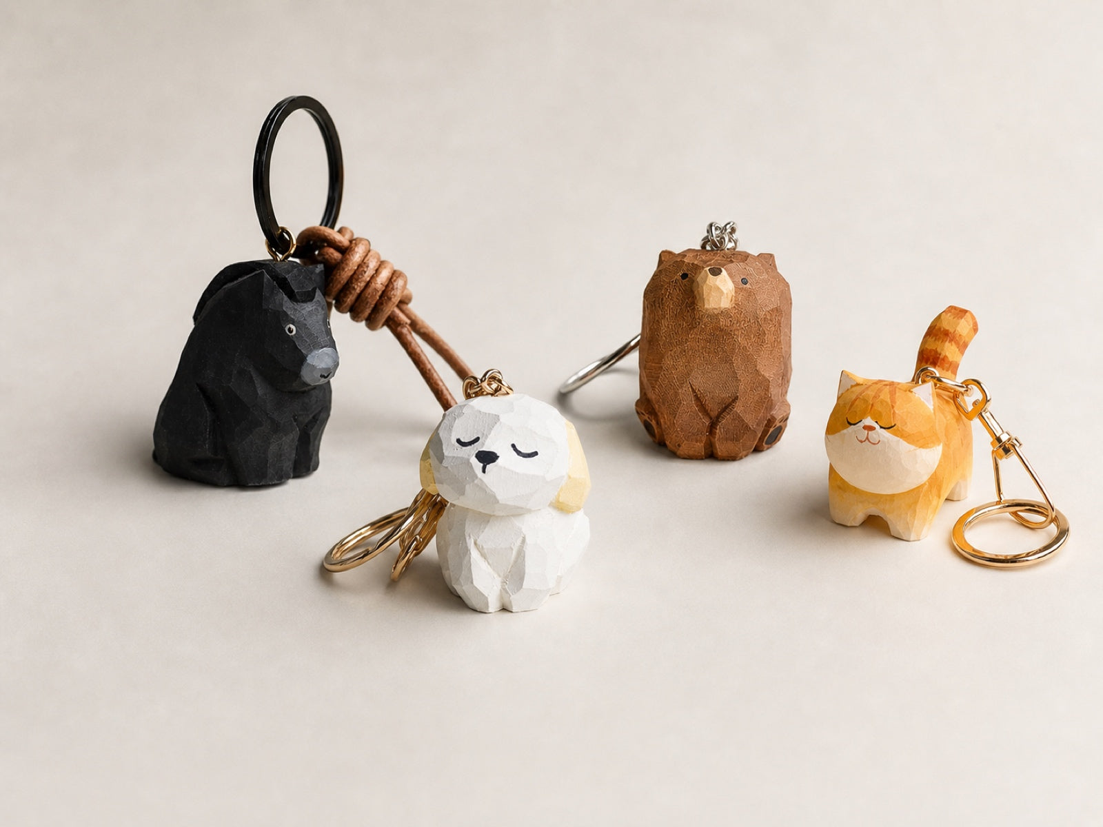 Small hand-carved wooden character keychains