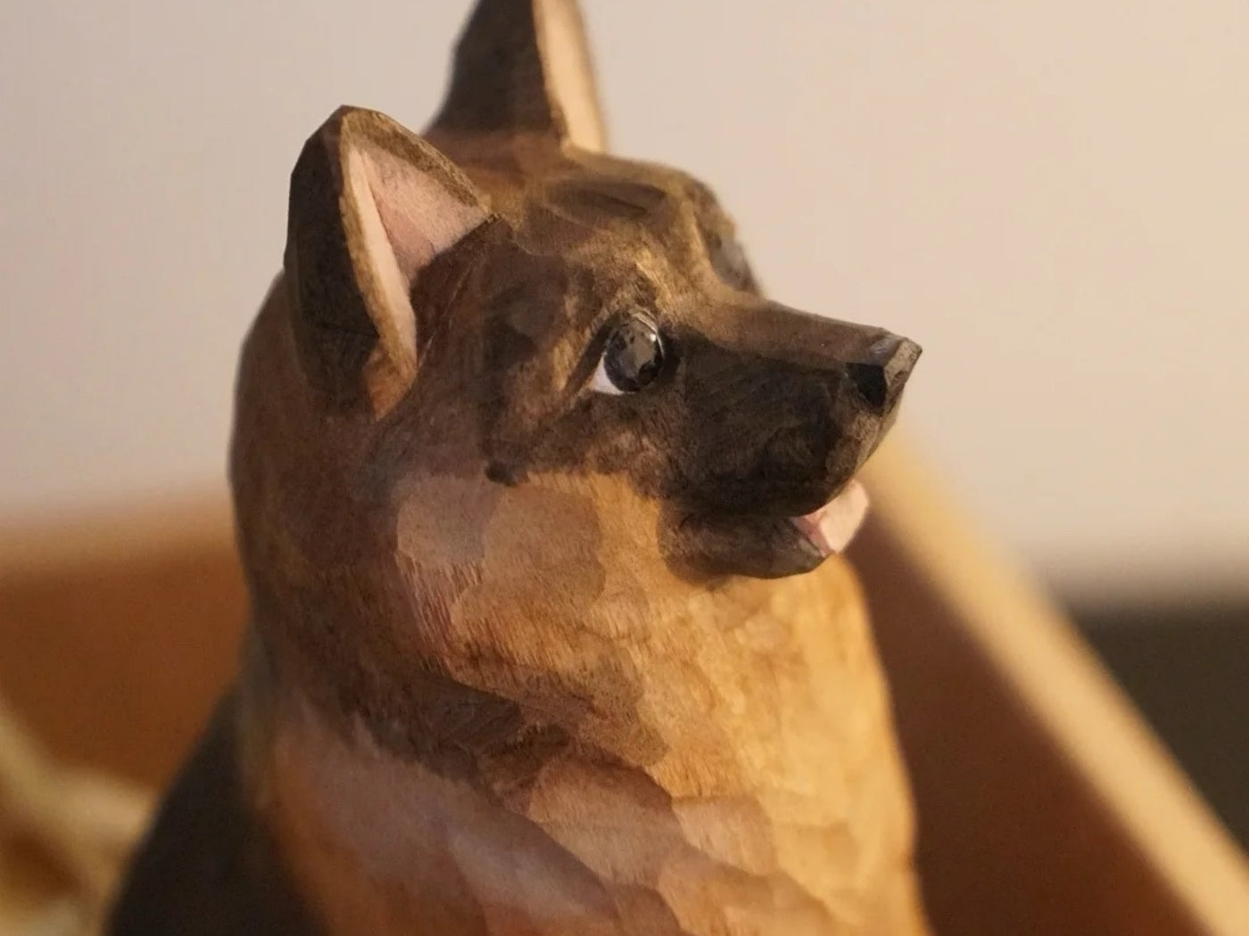 A small Wooden Smile carving shown in a collected interior