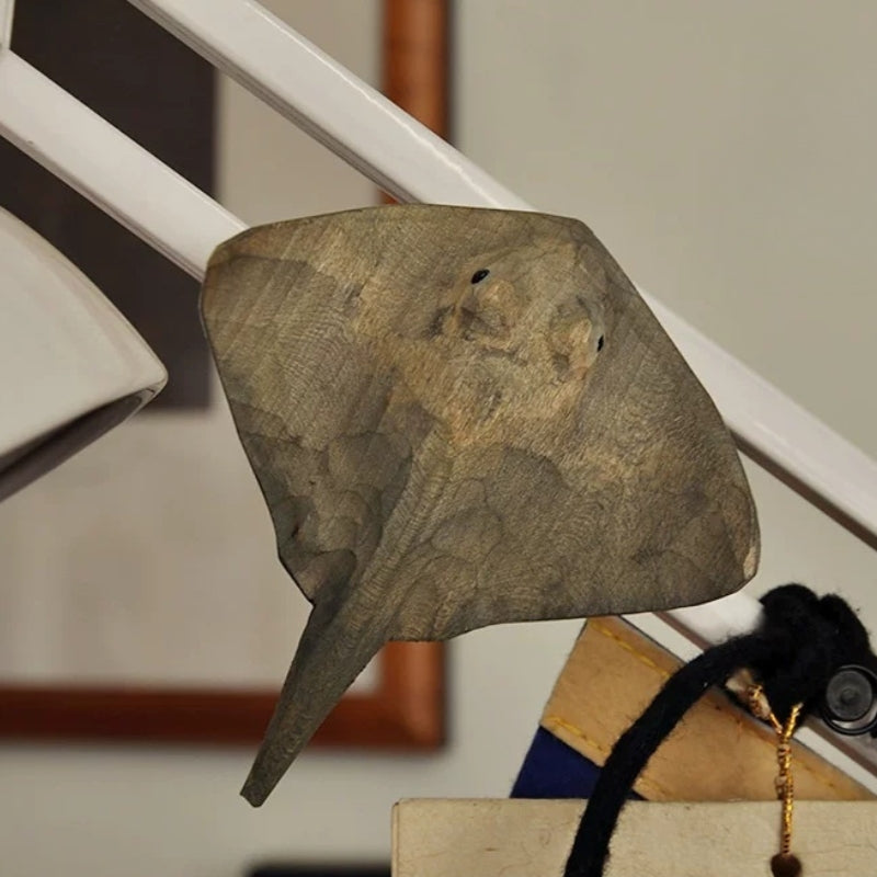 Carved wooden stingray magnet with curved wings