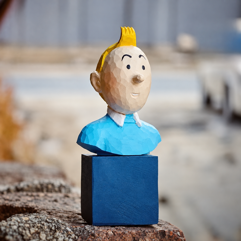 Wooden Tintin figure on its blue display stand outdoors