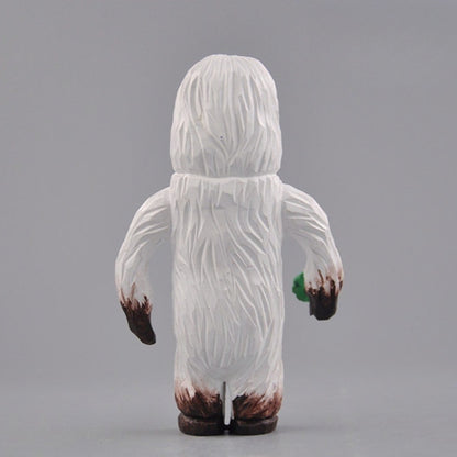 Yeti figurine back view carved wooden texture