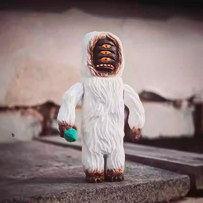 Yeti figurine carved multi eye face detail