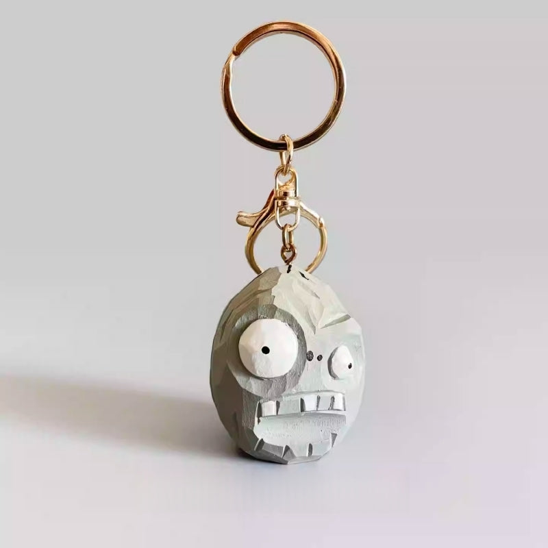 Front view of the handmade Zombie Wall-nut keychain with gold keyring, inspired by Plants vs Zombies.